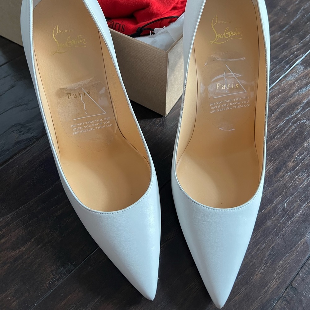 White Louboutins with scratch resists bottoms